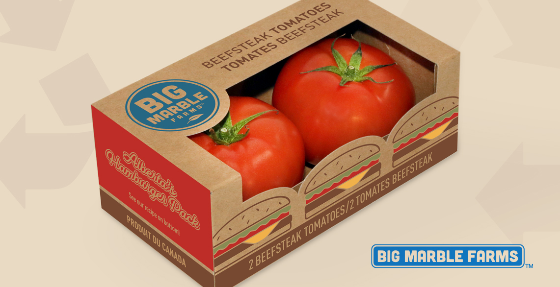 two beef steak tomatoes in a card board box designed by tugboat group